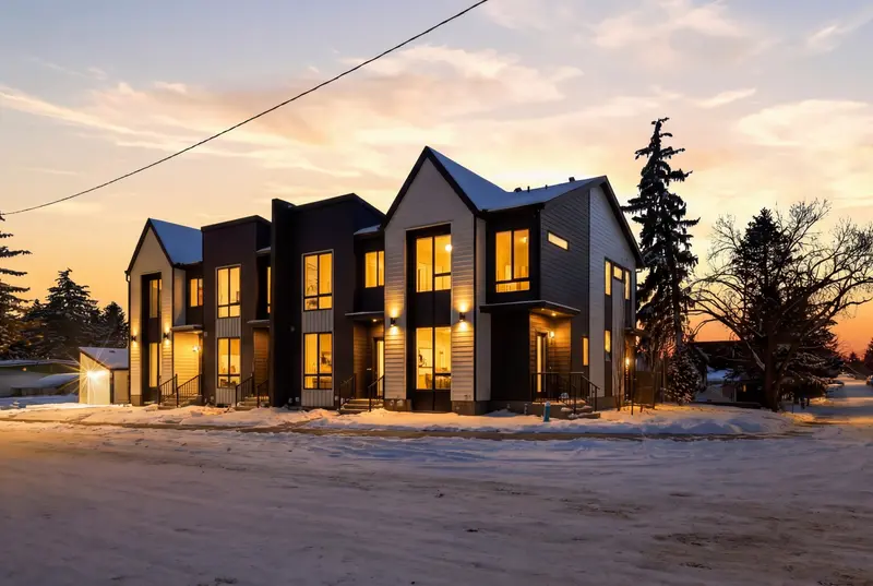 Calgary home at twilight with warm windows